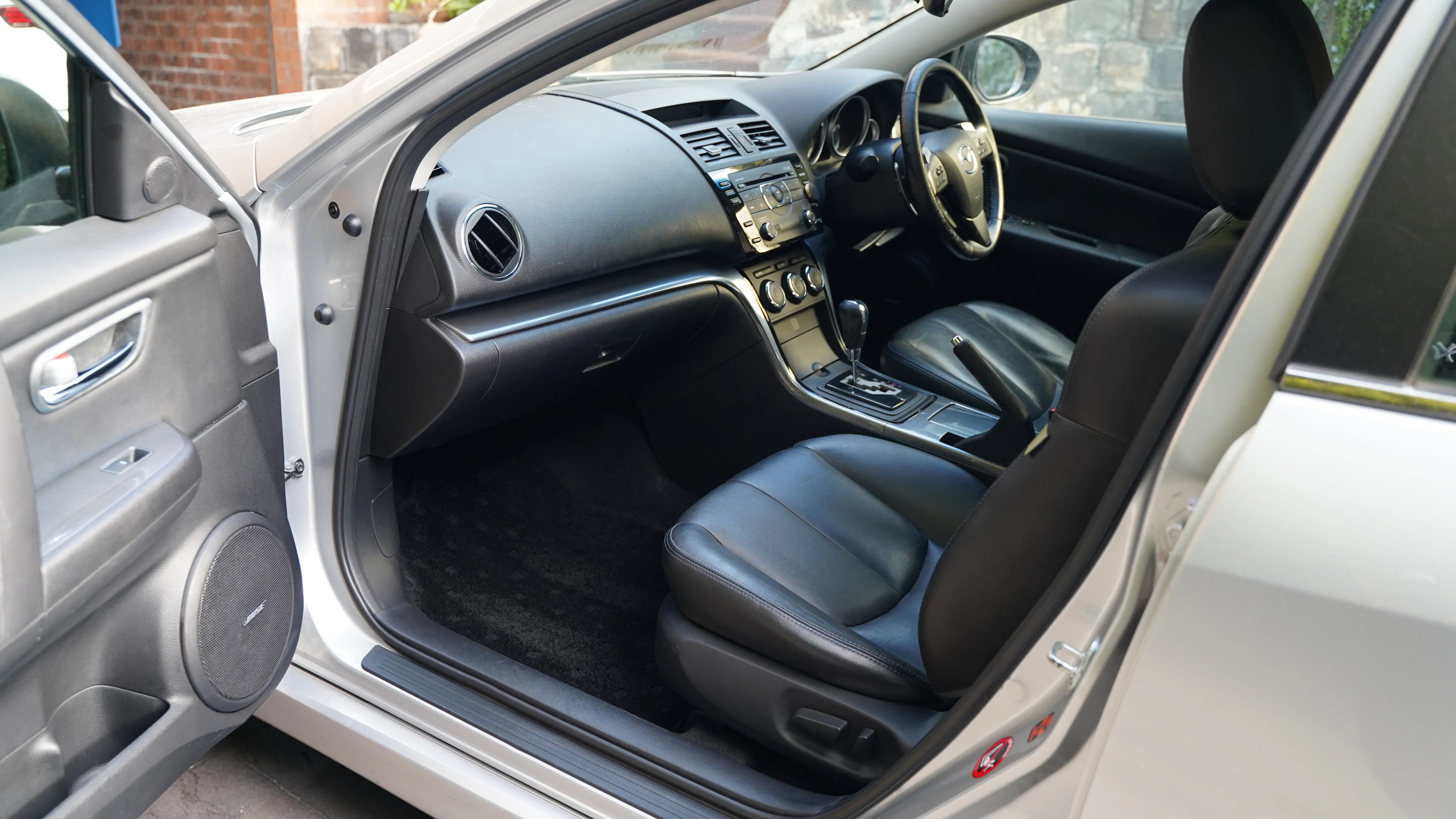 Front seat and dashboard view of a car detailed by NovaLux Auto Detailing in 2024, highlighting the clean and well-maintained interior.